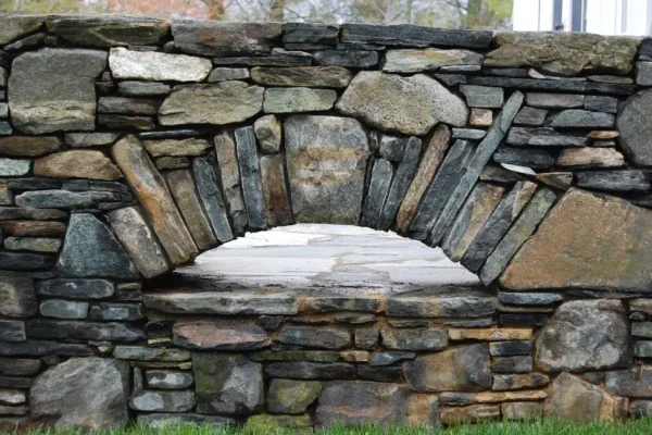 Decorative stone wall with an arch feature